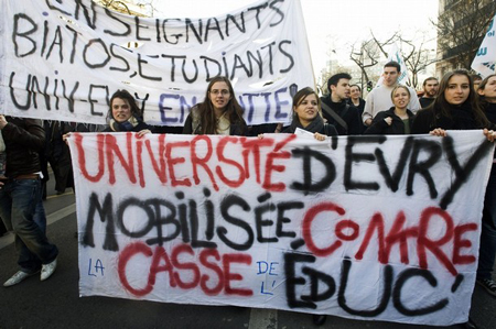 Students hold a banner which reads "University of Evry Against the Breakdown of Education" during a demonstration with teacher and university researchers in Paris February 19, 2009